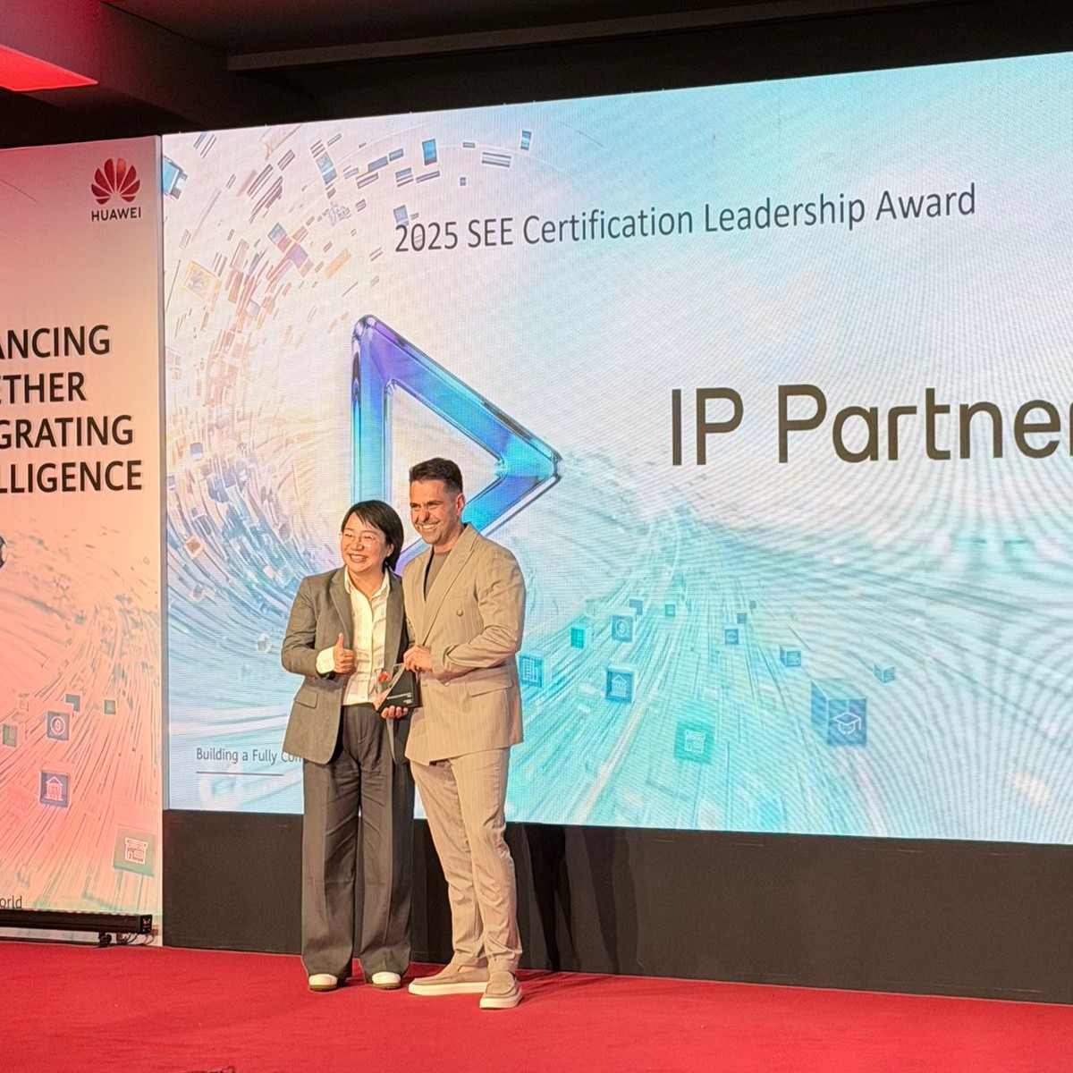 IP Partners representative receiving the 2025 SEE Certification Leadership Award on stage from a Huawei executive at the Huawei South East European Partner Summit 2026.
