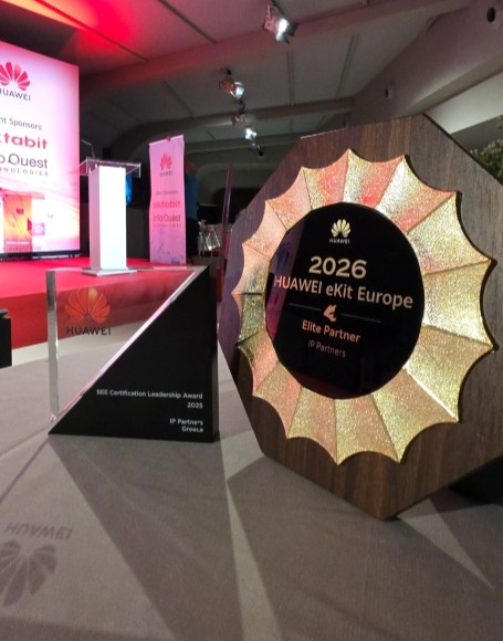Two Huawei awards displayed side by side: the 2025 SEE Certification Leadership Award crystal trophy and the 2026 HUAWEI eKit Europe Elite Partner plaque presented to IP Partners..